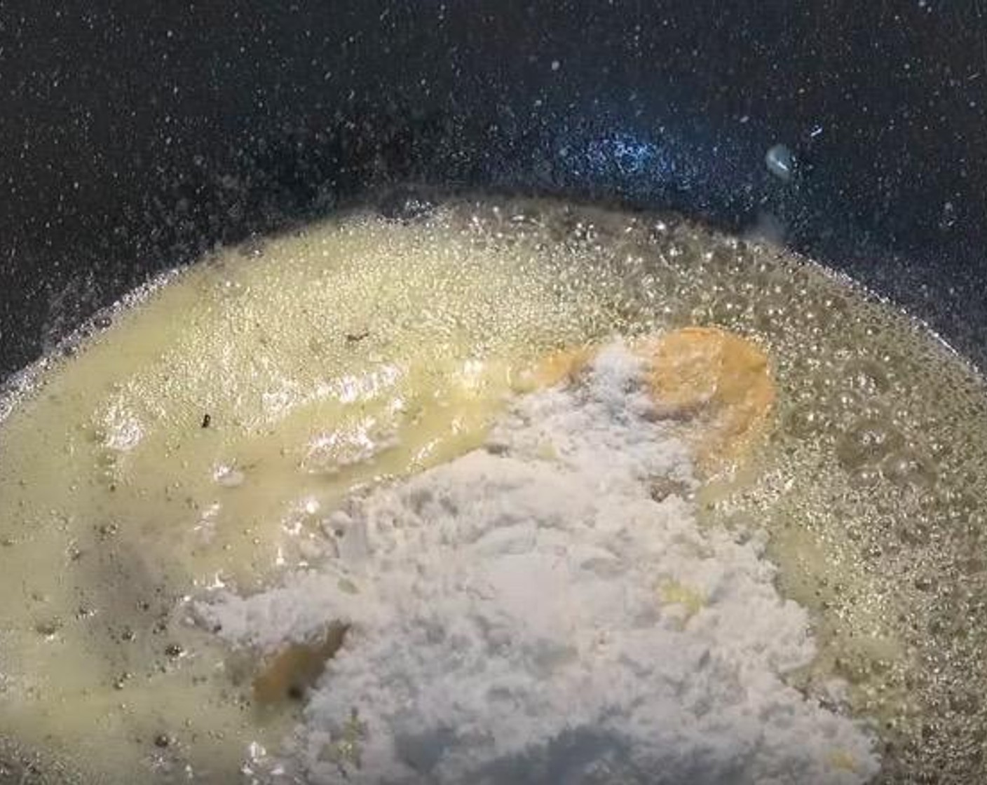 step 3 In a large pan, add Butter (2.5 oz). Once butter is melted, add in Dijon Mustard (1 tsp) and All-Purpose Flour (4 Tbsp). Whisk together until it becomes a smooth paste.