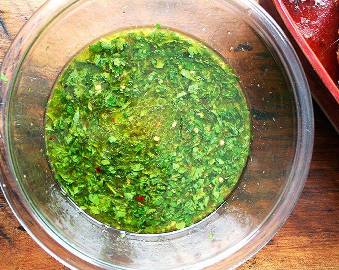 step 3 Combine Garlic (2 cloves), Kosher Salt (1 tsp), Freshly Ground Black Pepper (to taste), Crushed Red Pepper Flakes (1/4 tsp), Fresh Parsley (1/2 cup), White Wine (2/3 cup), Chicken Stock (1/2 cup), Olive Oil (4 Tbsp), zest and juice from Lemon (1) in a bowl and whisk to blend.