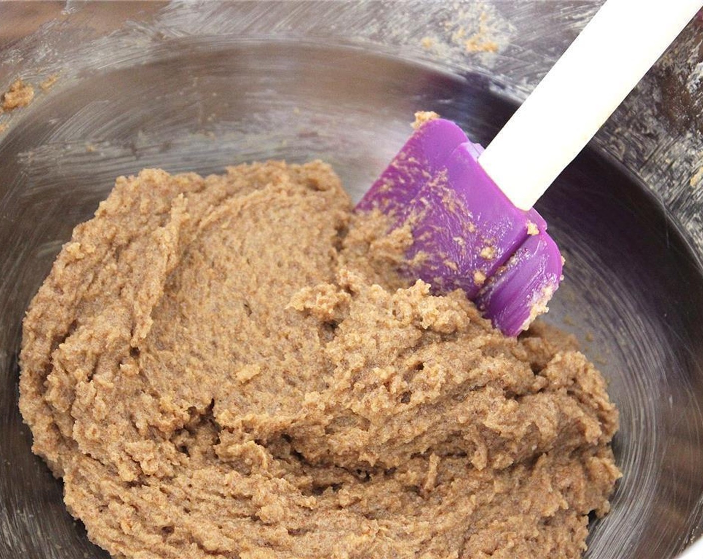 step 2 In a larger bowl, add the Vegetable Shortening (1/2 cup), Vegan Margarine (1/2 cup), Granulated Sugar (1/2 cup), Brown Sugar (1/2 cup), Vanilla Extract (1 tsp), and Unsweetened Apple Sauce (4 Tbsp) together. Beat until everything is well mixed.