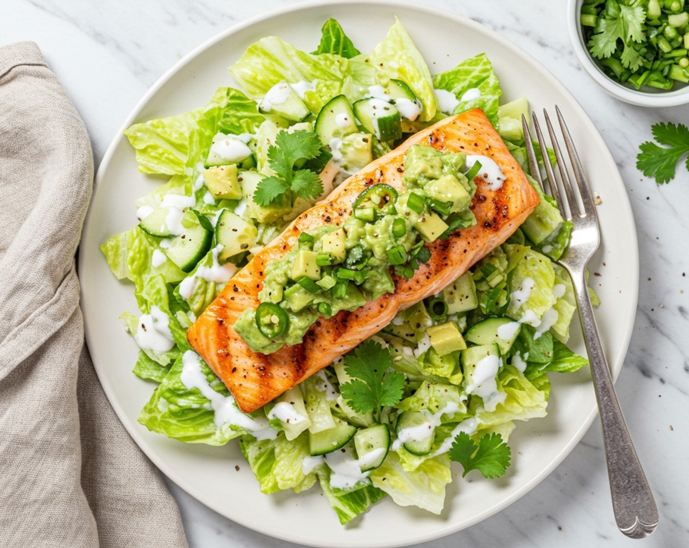 step 9 Place salmon on top, then spoon avocado salsa over top. Serve with lime wedges and cilantro sprigs. Enjoy!