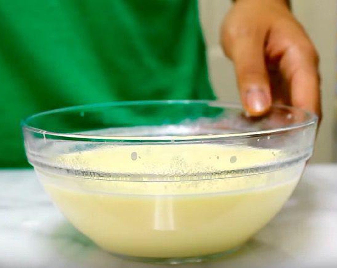 step 3 In a mixing bowl, add Large Eggs (2), Buttermilk (3/4 cup), and Whole Milk (3/4 cup). Whisk together until smooth.