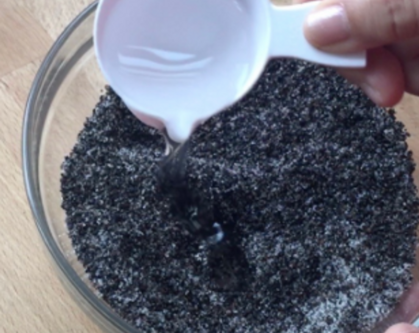 step 11 Transfer the ground sesame to a bowl. Add in Granulated Sugar (1 cup) and Coconut Oil (4 Tbsp).