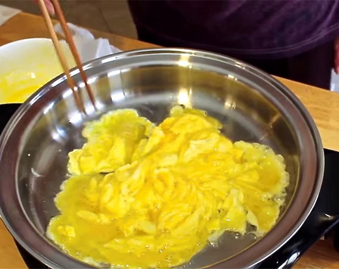 step 2 Heat Oil (2 tsp) in a frying pan. In a medium bowl, whip the Eggs (4) with the Salt (1/4 tsp) then stir-fry in the pan. Remove medium-well done eggs from the pan and set aside.