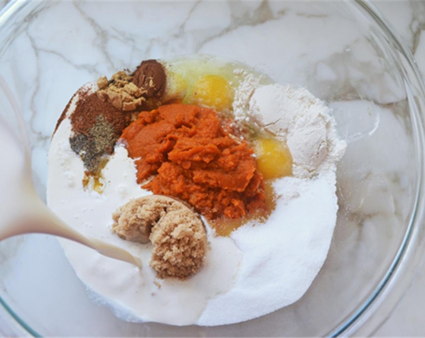 step 12 To make the filling, whisk together 100% Pumpkin Purée (1 can), Large Egg (1), Large Eggs (3) yolks, Granulated Sugar (1/2 cup), Brown Sugar (1/2 cup), All-Purpose Flour (2 Tbsp), Salt (1/2 tsp), Ground Cinnamon (1 tsp), Ground Ginger (1 tsp),Ground Nutmeg (1/2 tsp), Ground Cloves (1/8 tsp), Ground Black Pepper (1/8 tsp), and Evaporated Milk (1 1/4 cups) in a large bowl.