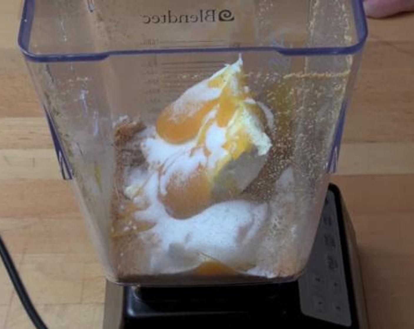 step 2 Add in the Cream Cheese (1/2 cup), Lemon Curd (3 Tbsp), Caster Sugar (2 Tbsp), and Milk (2 cups). Pulse everything together.