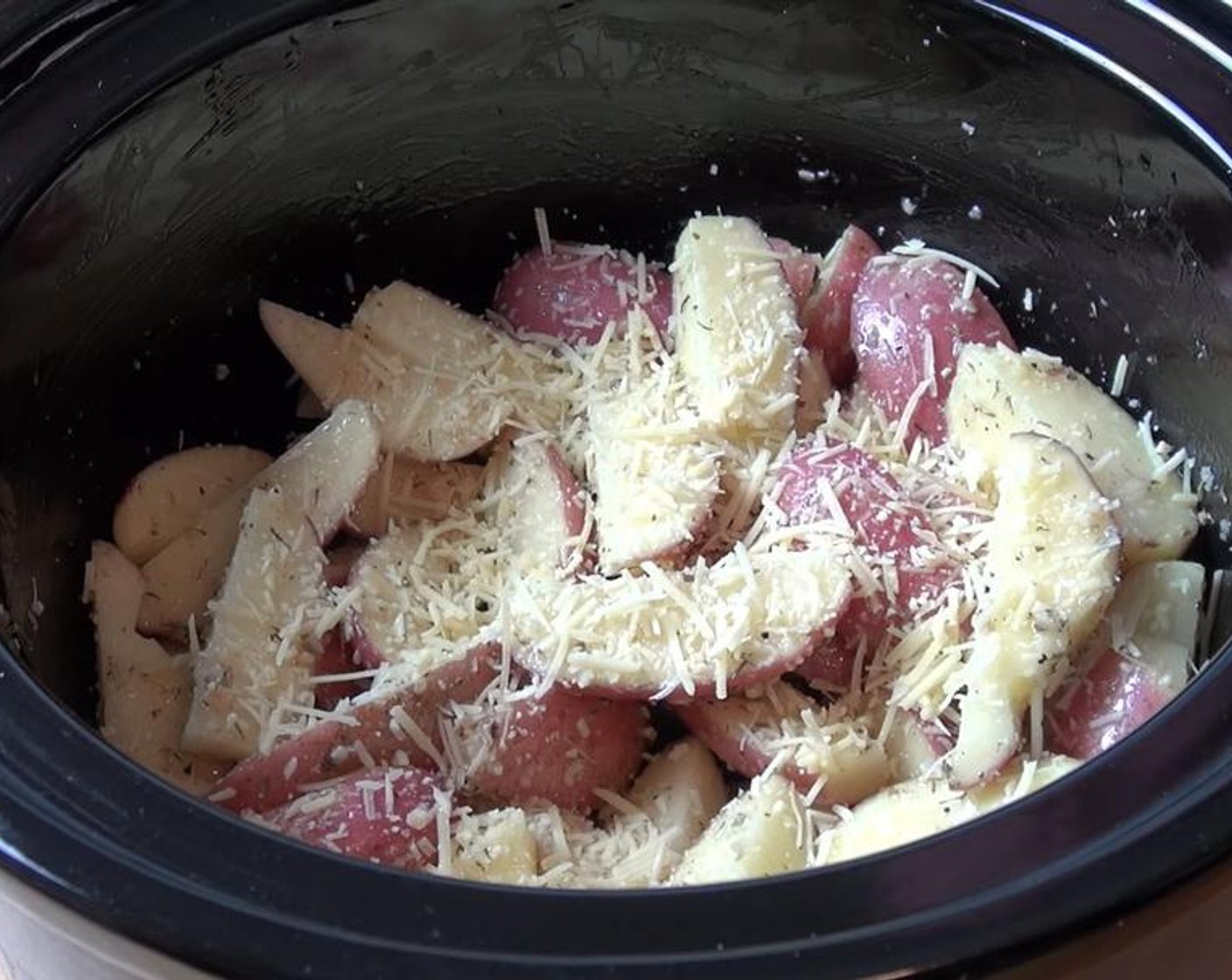 step 3 Pour the oil mixture over the potatoes. Stir together. Sprinkle with Parmesan Cheese (4 Tbsp).