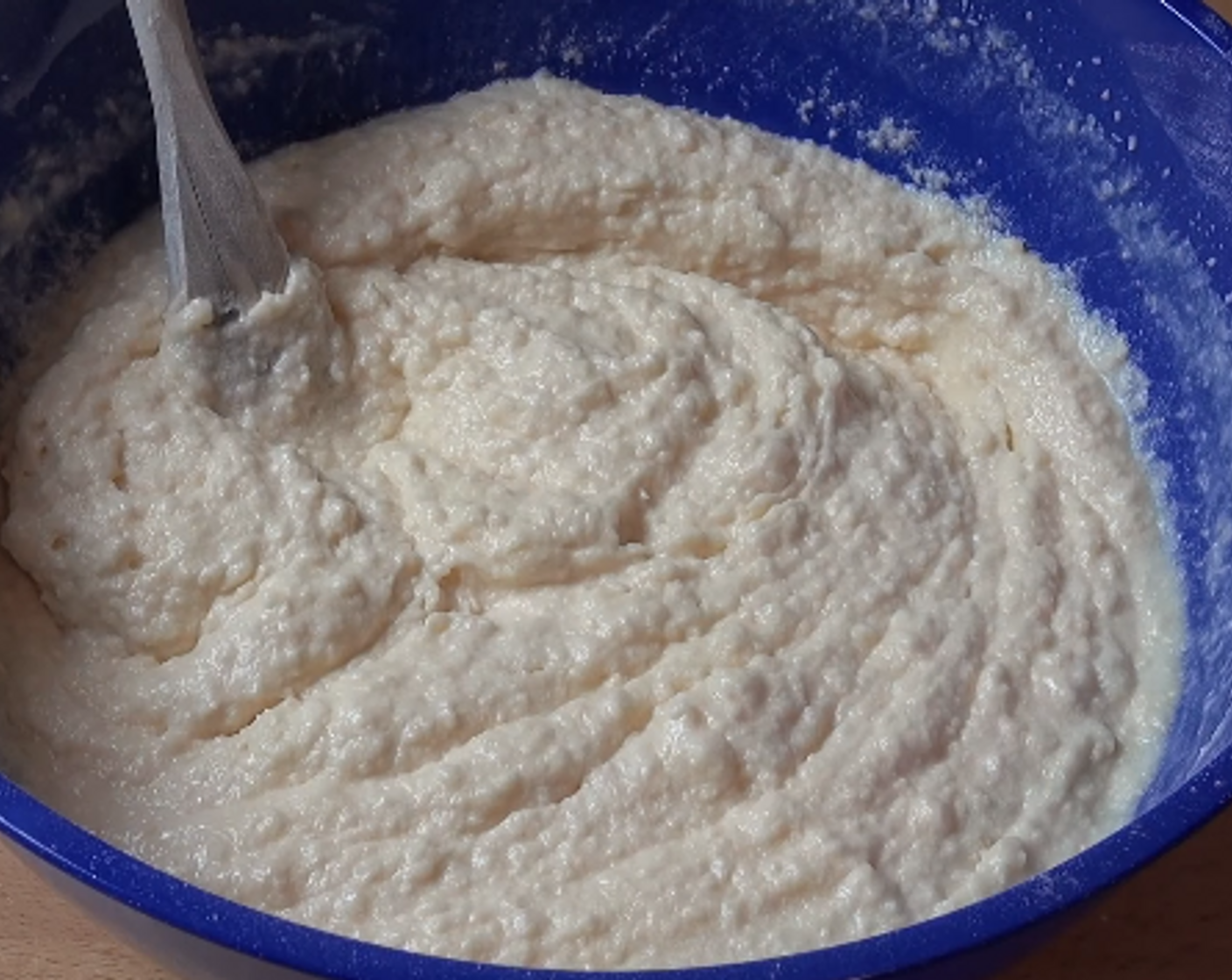 step 2 Add in the Eggs (2) one at a time, beating after each one. Sift in Self-Rising Flour (2 cups) and add Unsweetened Shredded Coconut (1 cup). Stir. Add Vanilla Extract (1 tsp) and Milk (1 cup). Stir again. Gently fold in Sprinkles (4 Tbsp).