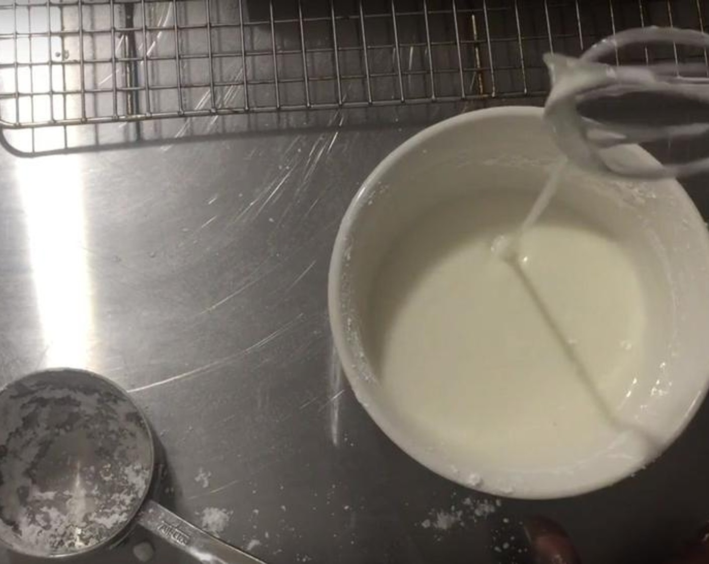 step 5 Let the cake cool for some time. Mix Powdered Confectioners Sugar (1 cup) and Milk (1 1/2 Tbsp) until it is nice and thick. Mix in Vanilla Extract (1 tsp). Drizzle the mixture on the cake with a whisk and let it sit until it hardens up, for about an hour.