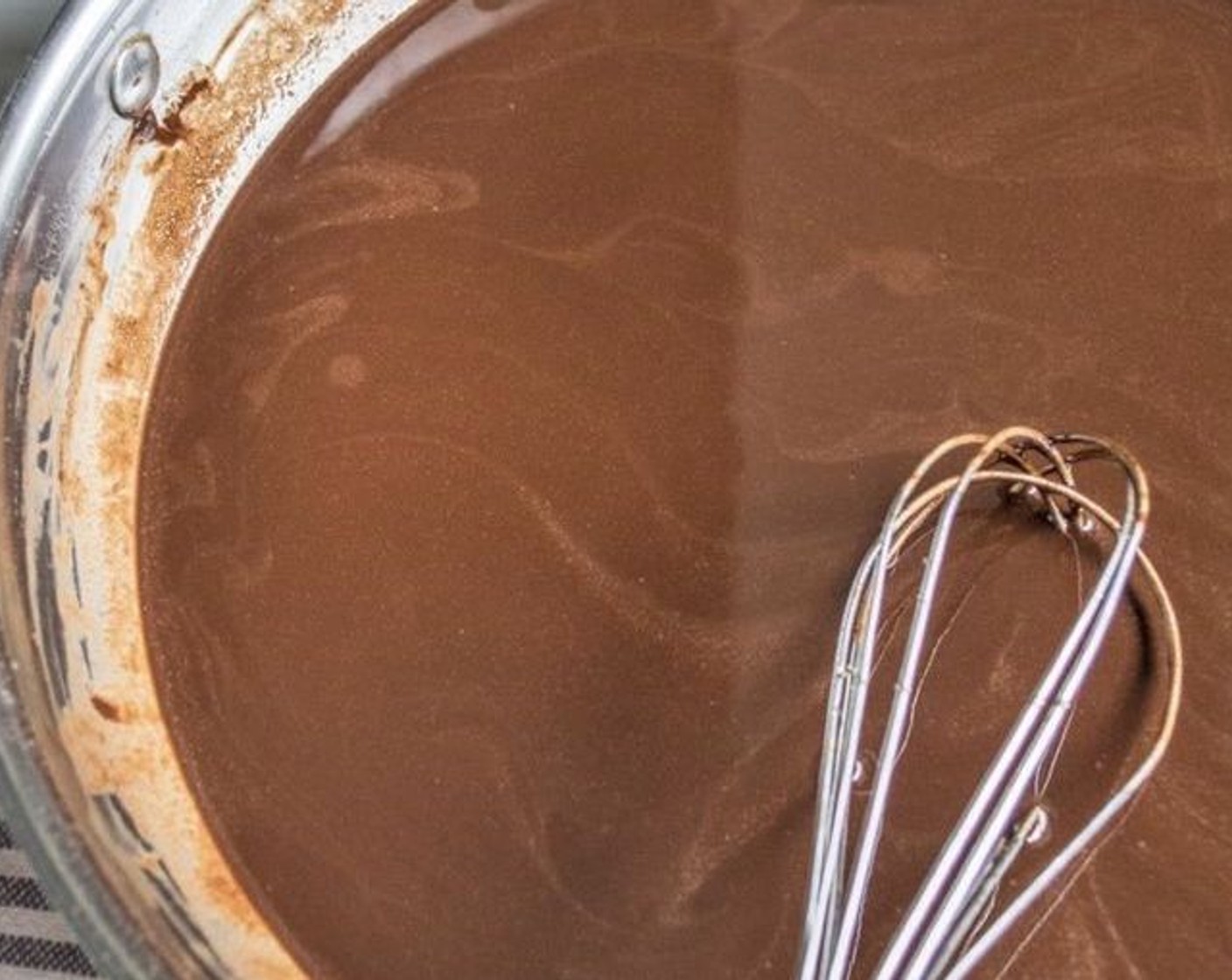 step 2 Once melted, remove from heat and whisk in 1 cup plus 1 Tbsp of Raw Cocoa Powder (1 cup), Maple Syrup (4 Tbsp), and Sea Salt (1/8 tsp).