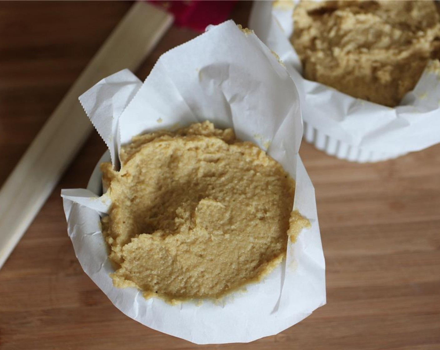 step 5 Using two ramekins covered with parchment paper, divide the mixture evenly between the 2 ramekins.