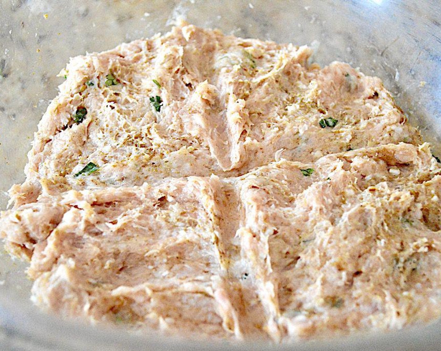 step 1 Combine the Ground Chicken (1 lb), Fresh Cilantro (1 Tbsp), Dijon Mustard (1 tsp), Ras el Hanout (1 tsp), Saffron Threads (1 pinch), Dried Onions (1/2 tsp), and Garlic Powder (1/2 tsp) in a large bowl and mix it all together thoroughly with clean hands. Press it into a single, even layer, then score it in half both vertically and horizontally to make four equal quarter pound portions.