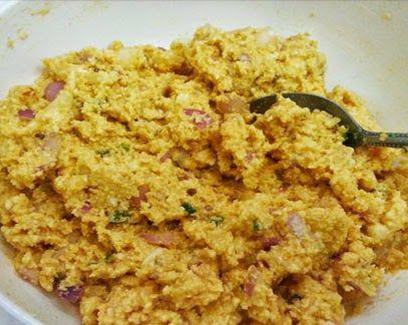 step 1 Chop Onion (1), Fresh Ginger (1 tsp) and Green Chili Pepper (1 tsp). Mix together Paneer (1/2 cup), Chickpea Flour (1/3 cup), Rice Flour (3 Tbsp), Red Chili Powder (1/2 tsp), Ground Turmeric (1/4 tsp), Asafoetida (1 pinch), Salt (to taste), onion, ginger, and green chili. To this add required water and make it a thick paste.