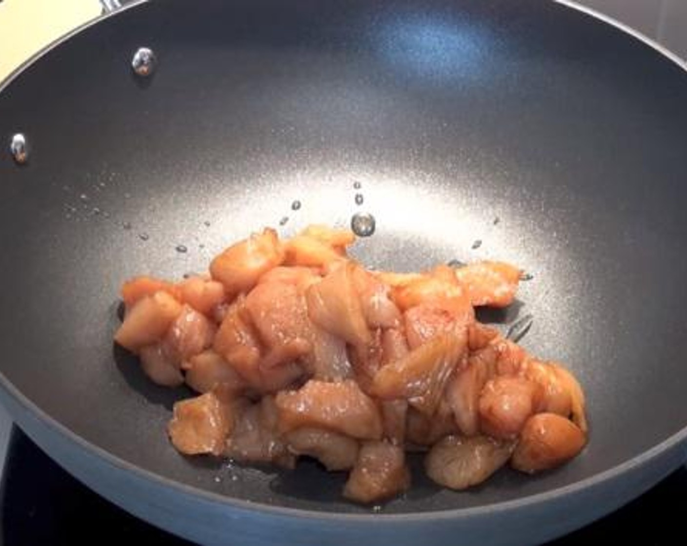 step 1 Into a wok greased with some Sesame Oil (1 1/3 Tbsp), cook the Chicken Breasts (1.1 lb). Set aside for a while.