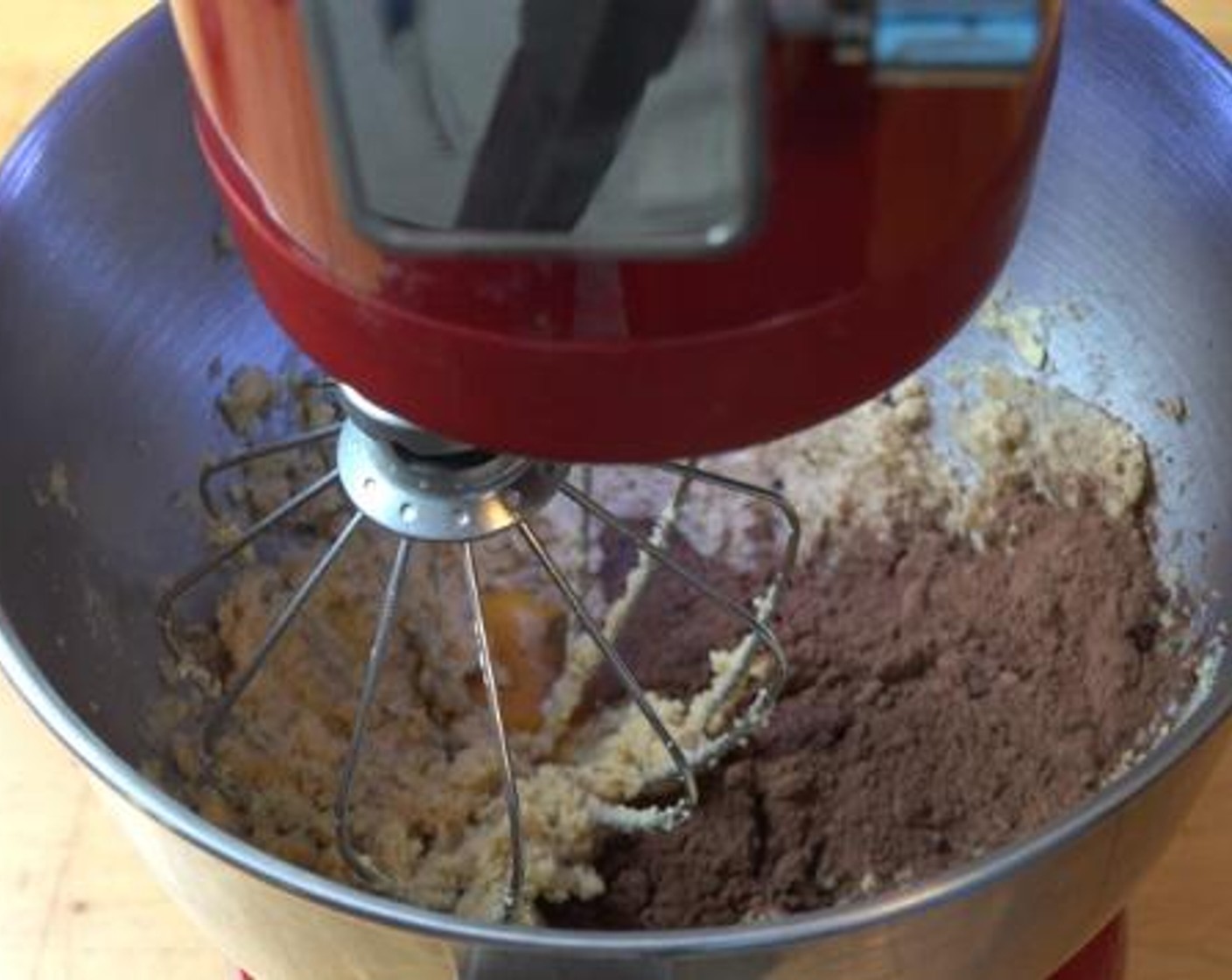 step 3 Then, add the Egg (1), Vanilla Extract (1/2 tsp), Unsweetened Cocoa Powder (4 Tbsp), and Red Food Coloring (2 Tbsp). Beat everything together.