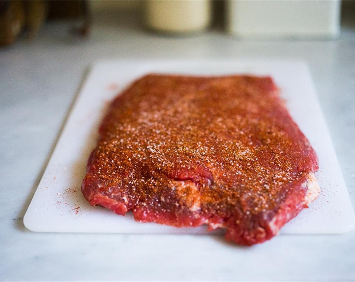 step 2 In a small bowl, mix Kosher Salt (1 tsp),Ground Cumin (1 tsp), Smoked Paprika (1 tsp). Coat both sides of Flank Steak (2 lb) with the spice rub and let sit at room temp while you make the salad or up to 30 minutes.