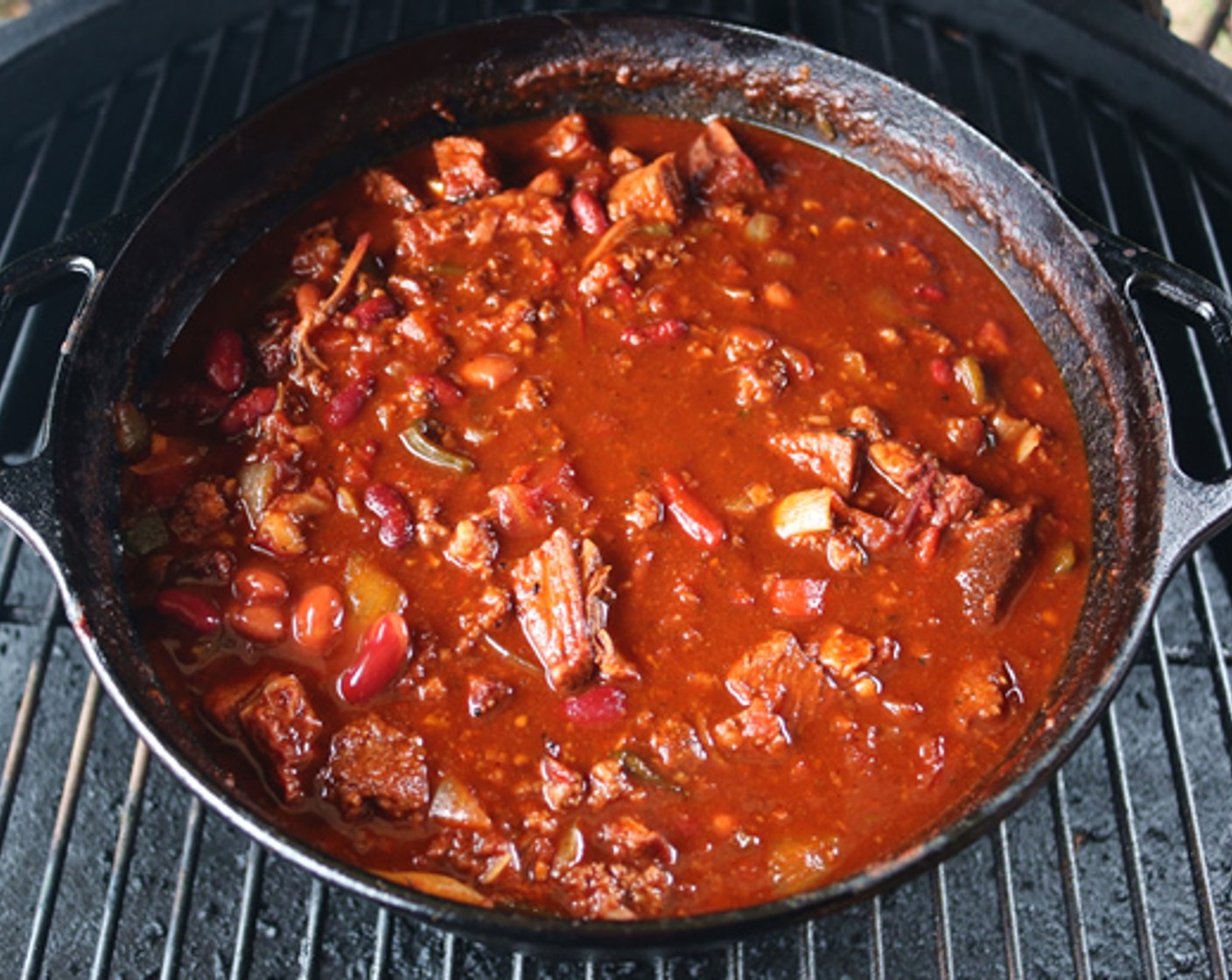 step 8 Place iron pot on Big Green Egg and cook uncovered for 2 1/2 hours, stirring occasionally.