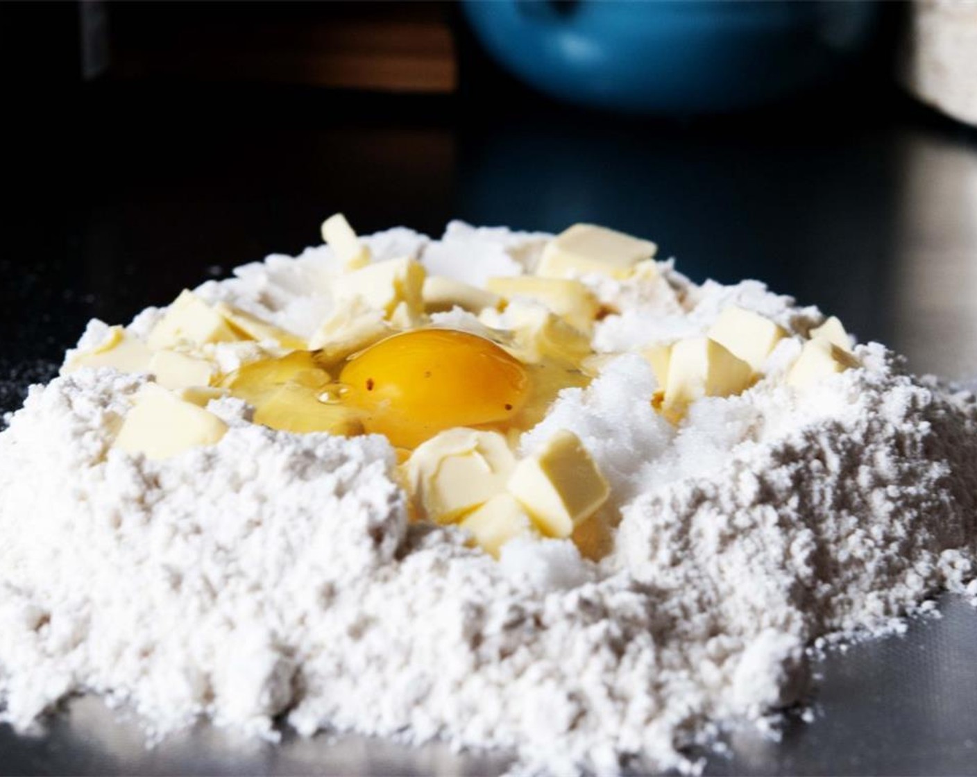 step 6 For the crust, combine All-Purpose Flour (1 cup), Large Egg (1), Unsalted Butter (3 1/2 Tbsp). Granulated Sugar (4 Tbsp), Baking Powder (1/2 tsp), and 1 tsp of zest from Lemon (1/8) on your kitchen counter.