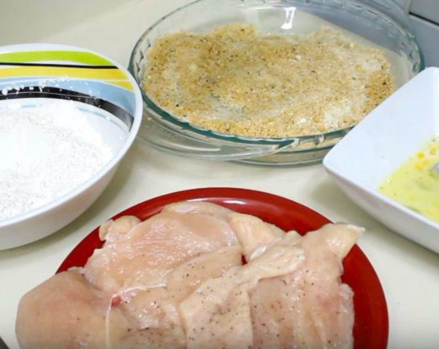 step 1 In a mixing bowl, add All-Purpose Flour (3/4 cup), Salt (to taste), and Ground Black Pepper (to taste). In another bowl, add Eggs (2), Milk (4 Tbsp), and additional salt and pepper and whisk together. In a final bowl, add Seasoned Panko Breadcrumbs (1 1/4 cups) and Parmesan Cheese (1/2 cup) and stir together.