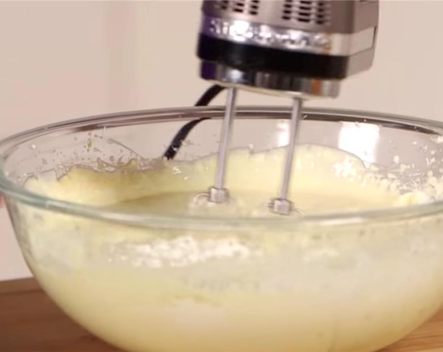 step 7 Add the All-Purpose Flour (4 Tbsp), Vanilla Extract (2 tsp) and 2 tsp of juice from Lemon (1) and mix well. Add the Sour Cream (2 cups) and beat well. Firmly tap the bowl against the counter to release bubbles from the filling.