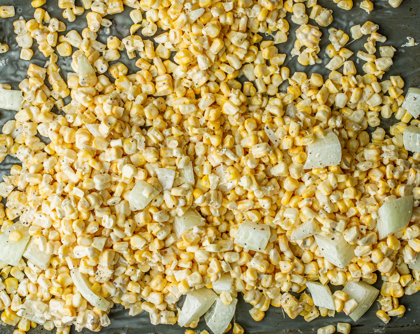 step 5 In a medium bowl, add the Corn (3 ears), Onion (1/2), Fresh Cilantro (4 Tbsp),  2 Tbsp of Mayonnaise (2 Tbsp), 4 Tbsp of juice from 2 Limes (2), ¼ cup of Cotija Cheese (4 Tbsp), Kosher Salt (1/2 tsp), and Ground Black Pepper (1/4 tsp) and mix well.