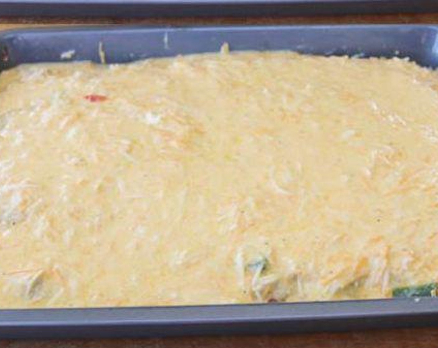 step 6 Spread sausage and vegetables over the dough evenly and top with egg mixture. Rest the casserole for at least 1 hour in the refrigerator.