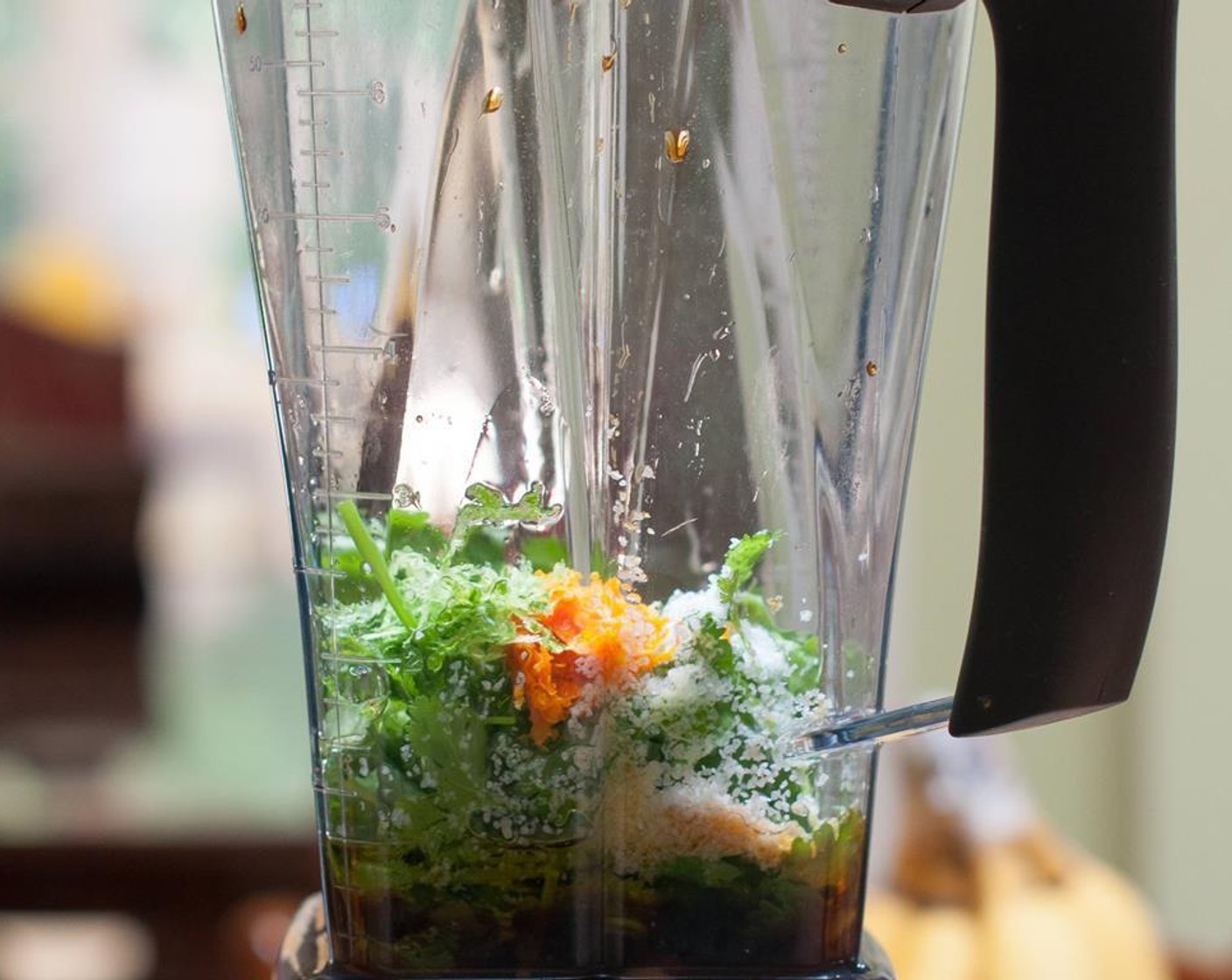 step 3 Put the Fresh Cilantro (1/2 bunch), Scallions (3 Tbsp), zest and juice of lime and orange, Garlic (2 cloves), Olive Oil (2 Tbsp), Low-Sodium Soy Sauce (4 Tbsp), and Kosher Salt (1 Tbsp) in a blender and pulse.
