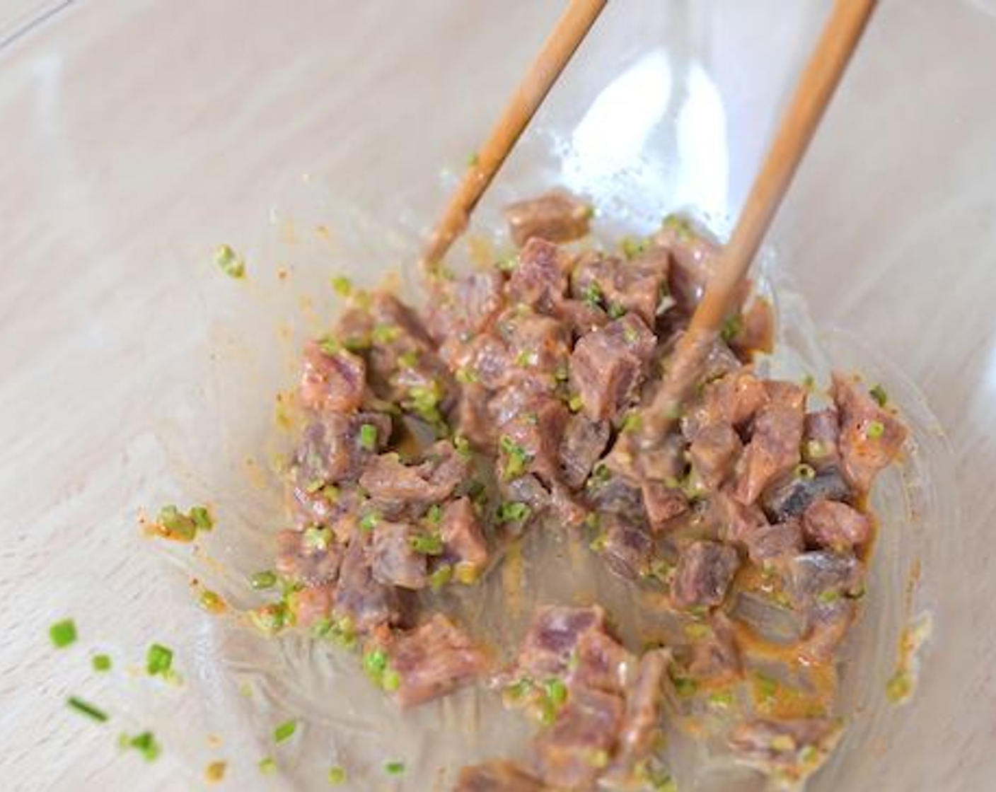 step 1 In a large bowl mix together the Sushi-Grade Tuna Fillets (3.5 oz), Chili Sauce (0.5 oz), Sriracha Mayonnaise (2 tsp), and Scallion (1/3 cup). Mix together.