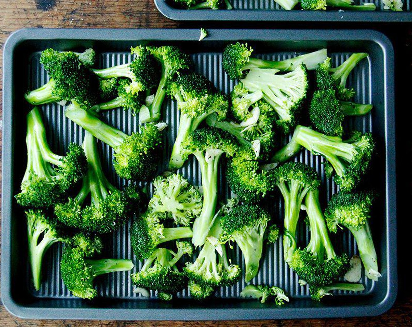 step 3 In a bowl toss the Garlic (2 cloves) with the broccoli and drizzle with 3 tablespoons of Extra-Virgin Olive Oil (as needed). Sprinkle with Kosher Salt (to taste) and Freshly Ground Black Pepper (to taste). Toss to coat evenly. Spread the broccoli in a single layer on a roasting tray.