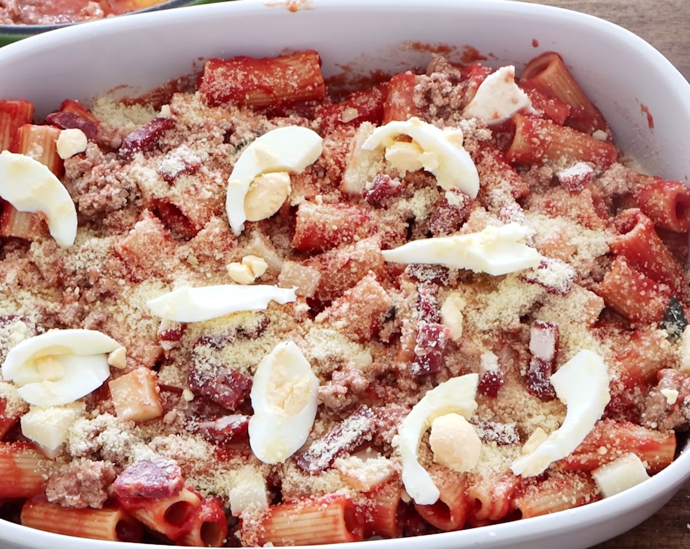 step 21 Repeat this until you run out of ingredients – or get to the top! On top of the final layer of pasta al forno, add a generous amount of provolone cheese, pecorino, salami, and eggs.