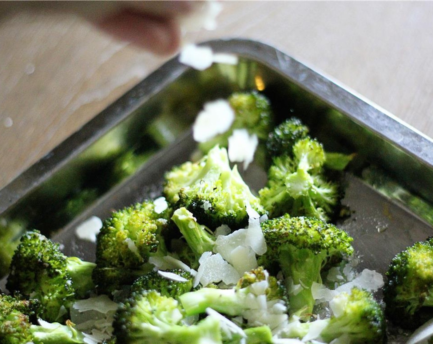 step 6 While steaks are cooking, transfer seasoned broccoli to an oven safe baking sheet or pan and bake for 10-12 minutes, or until broccoli is tender. Remove from oven and sprinkle with the Parmesan Cheese (4 Tbsp) while still warm.
