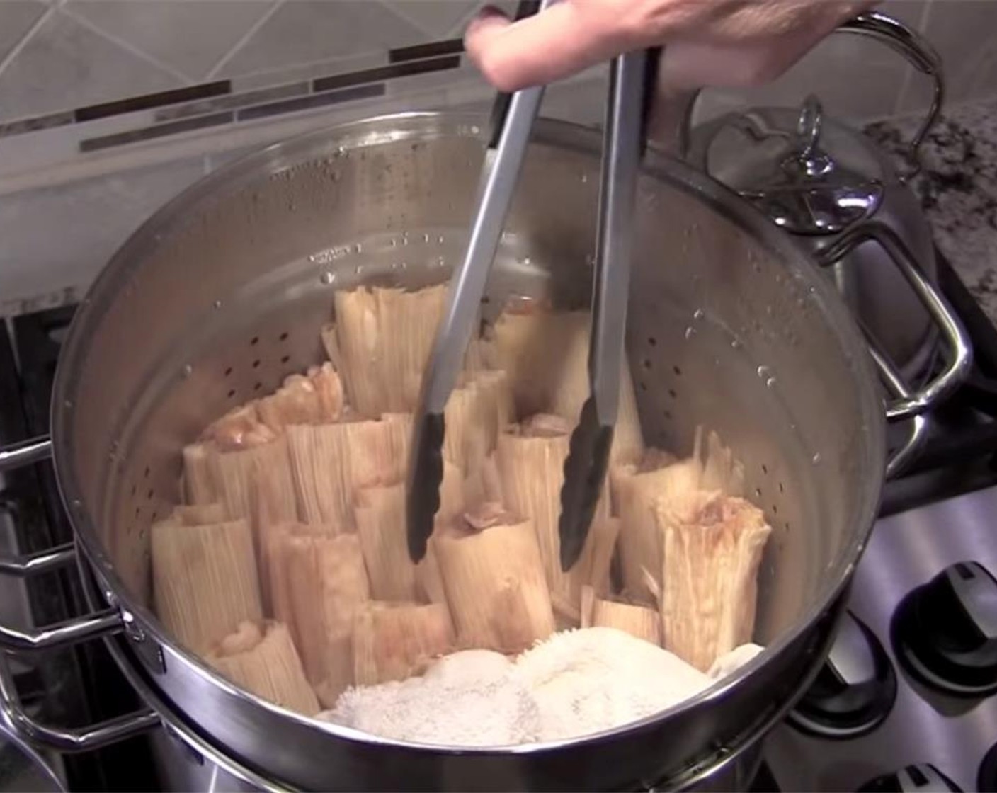 step 11 Bring water to a boil, then turn heat to low. Steam for 1 1/2 hours. Check if done by removing one, and letting cool for 5 minutes before opening to check if masa is firm and not mushy. If not done, cook longer, rechecking every 15 minutes.