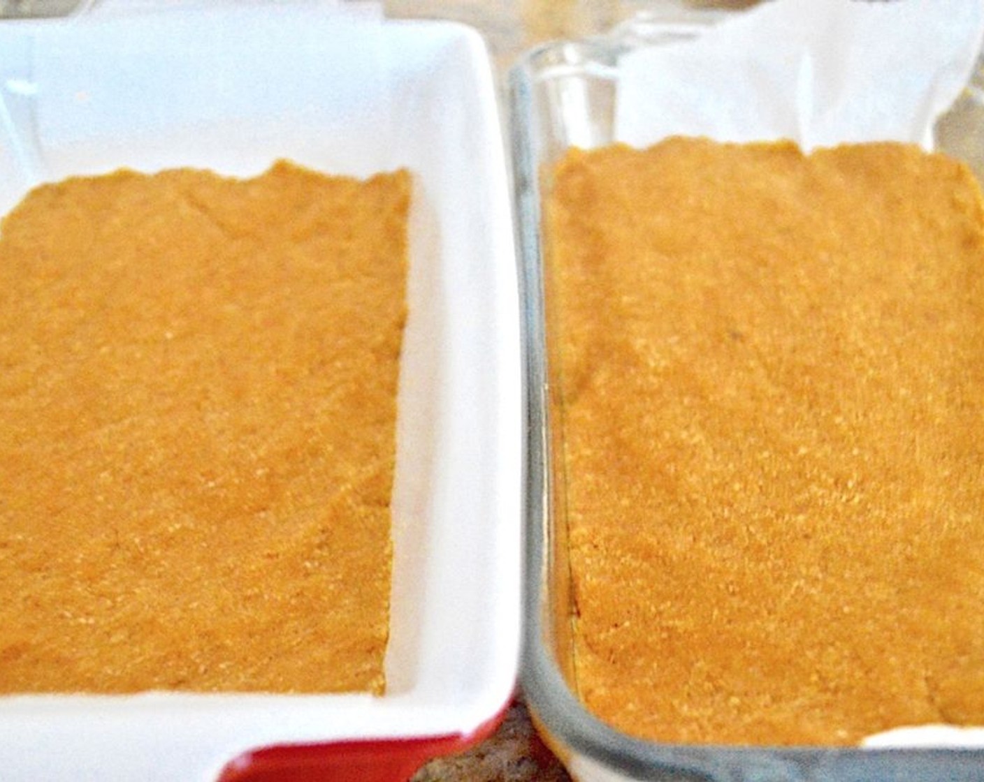 step 7 Divide the dough in half and press one half into each prepared loaf pan firmly so that it is a solid loaf.