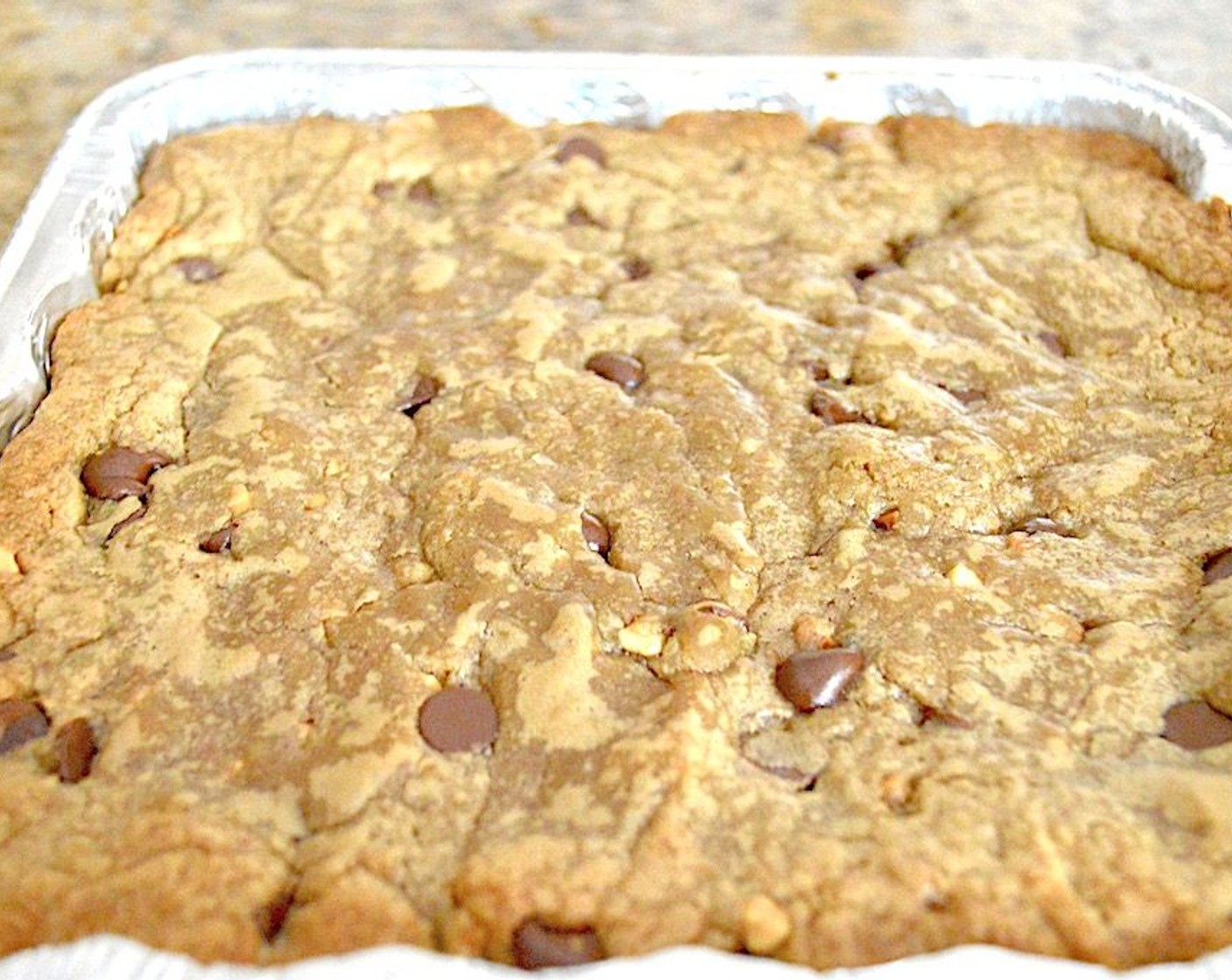 step 4 Spread the batter into an even layer in the prepared baking dish and bake it for 40-45 minutes. The top should be dry and starting to crisp up around the edges, while the center will still be slightly gooey.