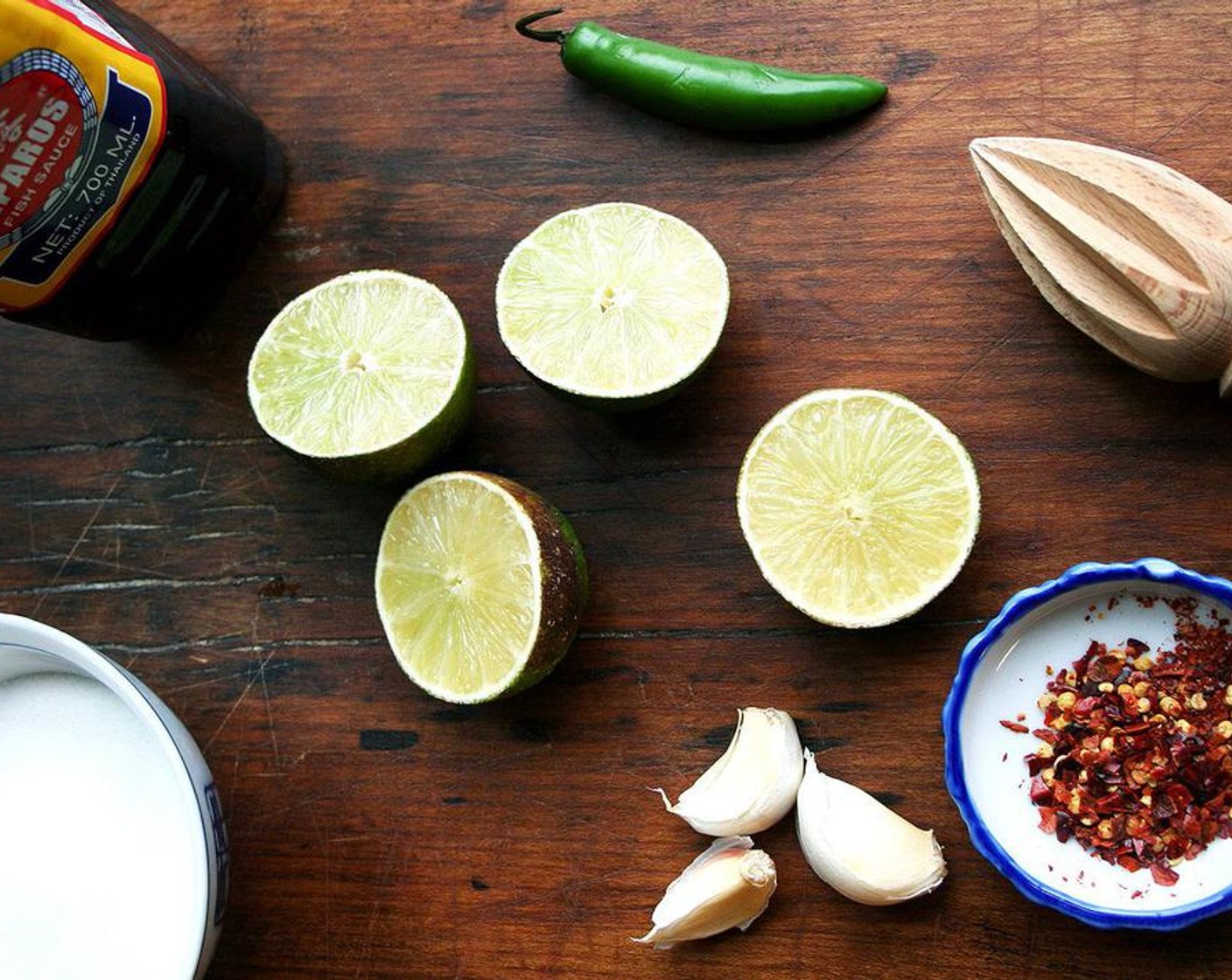 step 2 Meanwhile make the nuoc cham: In a medium bowl, whisk together the Granulated Sugar (4 Tbsp), Fish Sauce (1/3 cup), and juice from Limes (3 1/2) until the sugar is completely dissolved.