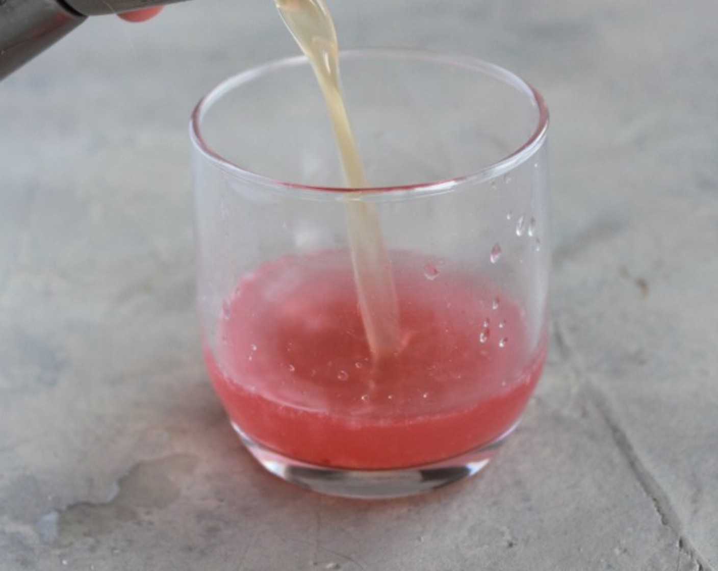 step 2 Add the juice of 1/2 of a Lemon (1/2), Gin (1.5 fl oz), and Grand Marnier (0.5 fl oz).