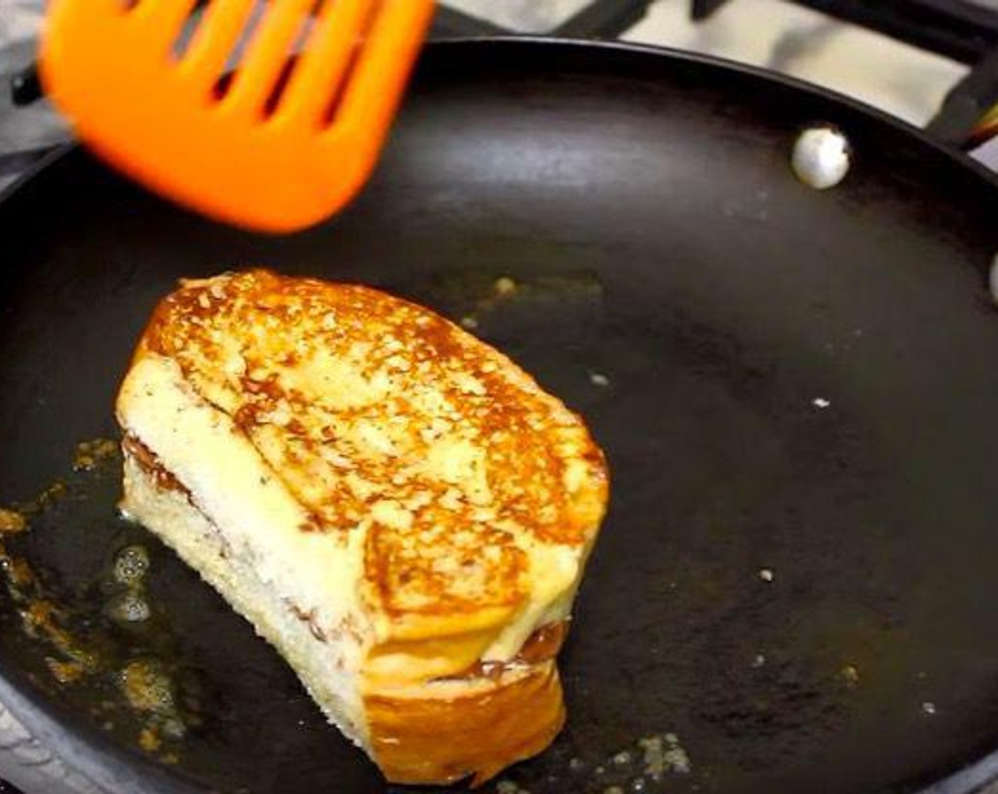 step 2 Take two pieces of Bread (8 slices) and spoon Nutella® (1/2 cup) on one bread. Dip the bread in the milk mixture for 20 to 30 seconds per side. Take a skillet with Butter (1 Tbsp) and fry the bread in low heat until brown.