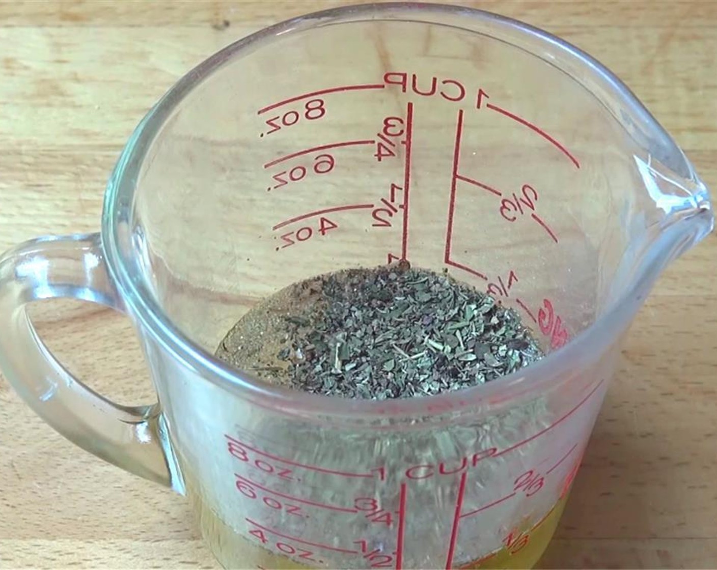 step 2 In a measuring cup mix Olive Oil (4 Tbsp), Garlic Powder (1 tsp), Onion Powder (1 tsp), and Dried Mixed Herbs (2 tsp). Season with Salt (to taste) and Ground Black Pepper (to taste) and mix well together.