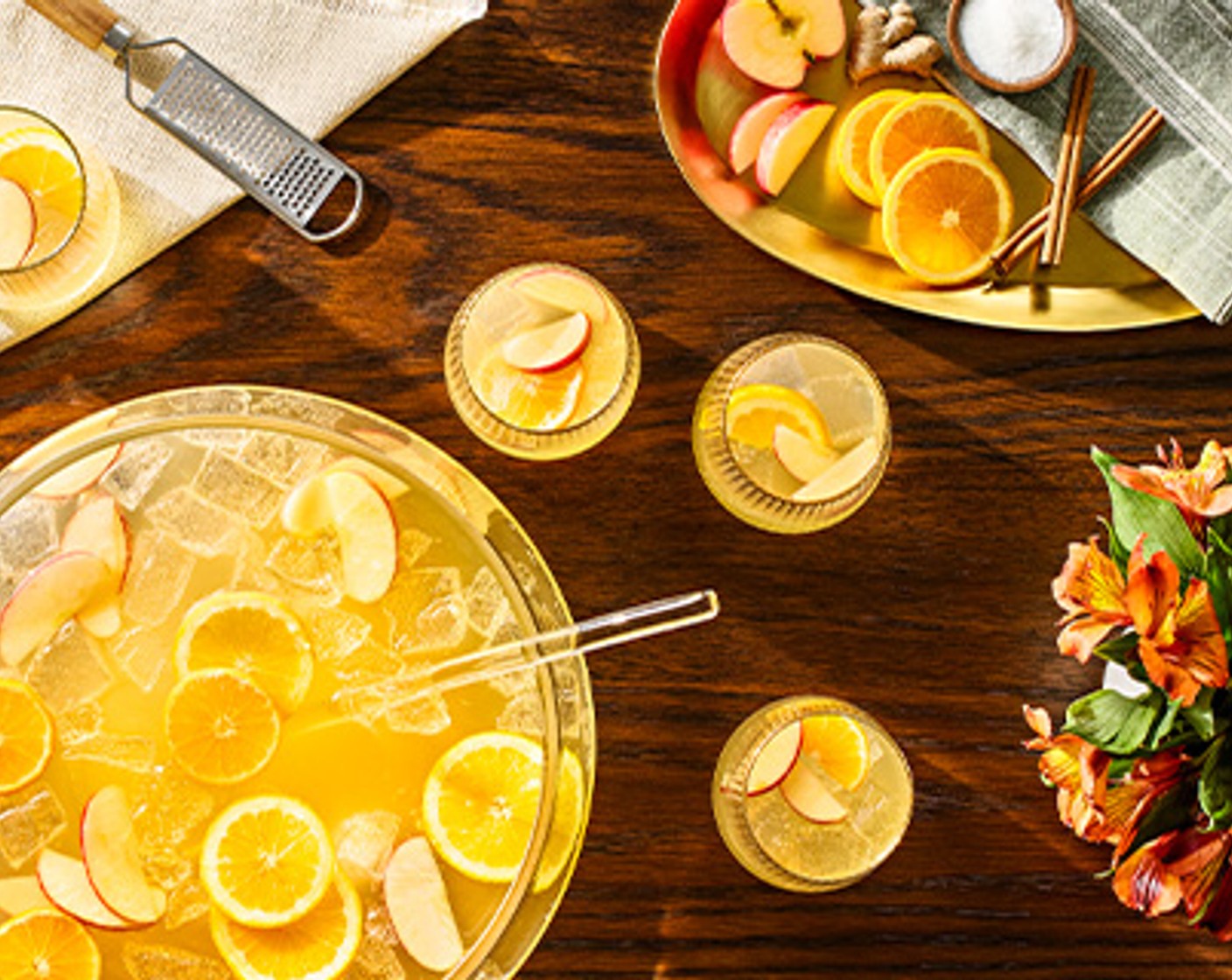 step 11 Using a slice of Orange (1 slice), wet the rim of the glasses, then dip into the cinnamon mix, turning to coat. Serve the punch in the rimmed glasses.