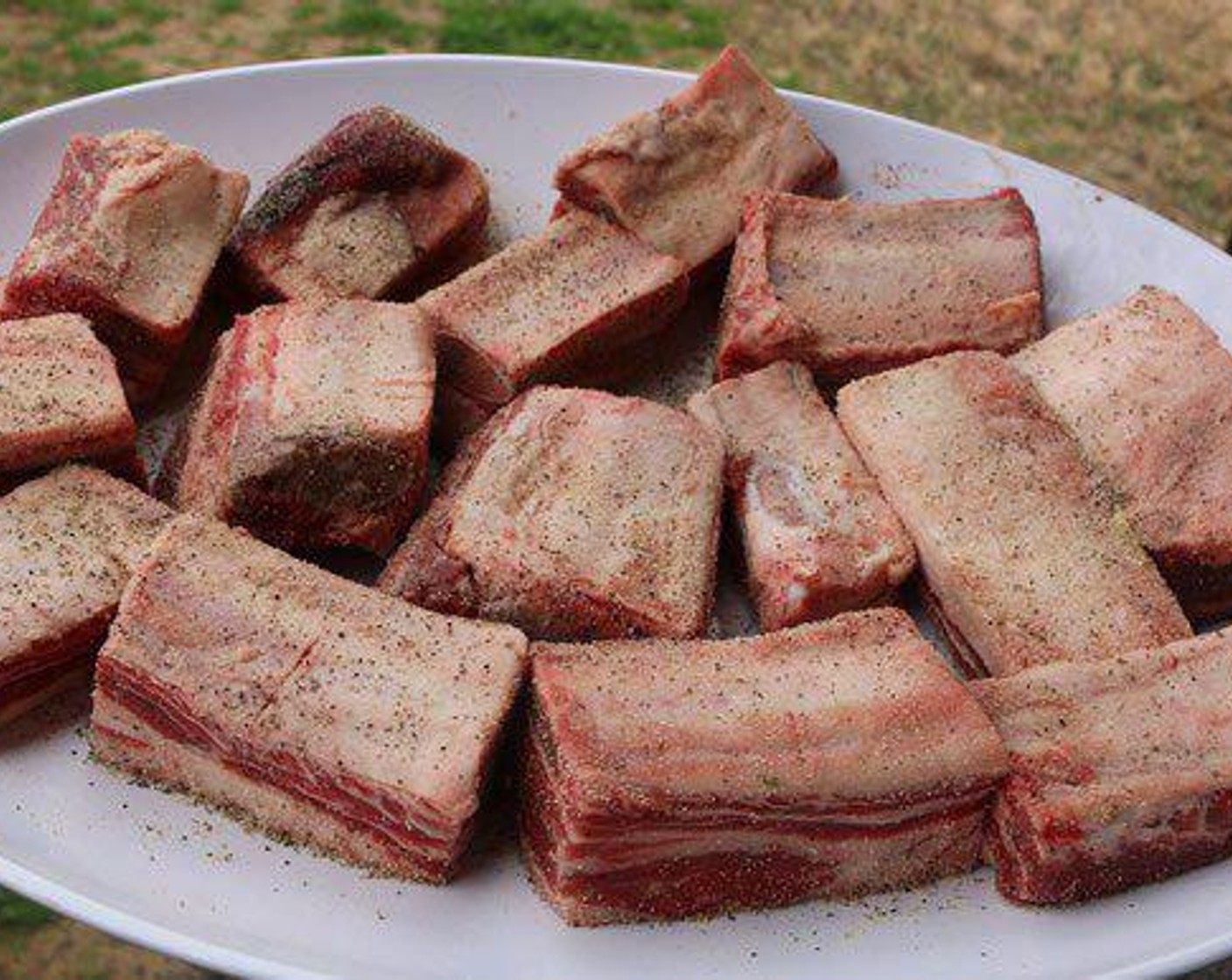step 2 Season outside of Beef Short Ribs (12) with All-Purpose Spice Rub (2 tsp). Place on pit and smoke for 3 hrs until brown on all sides.