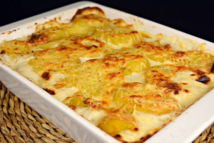 Creamy golden baked potato gratin dauphinoise