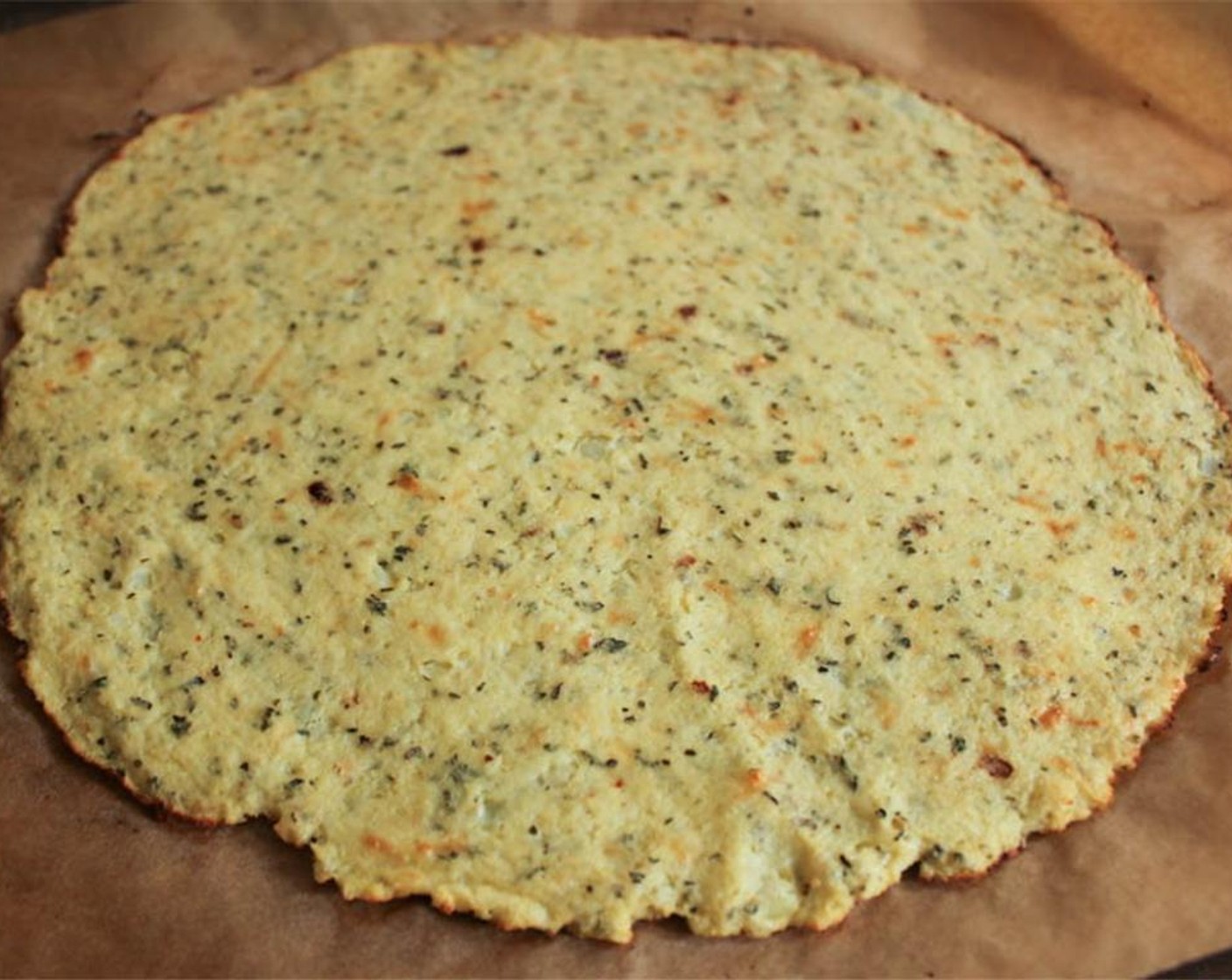 step 12 Carefully transfer your dough to the hot pizza stone/baking sheet. Place your vegetables in the oven along with your dough. Bake for 8-10 minutes until the dough is golden brown. Carefully remove it from the oven.
