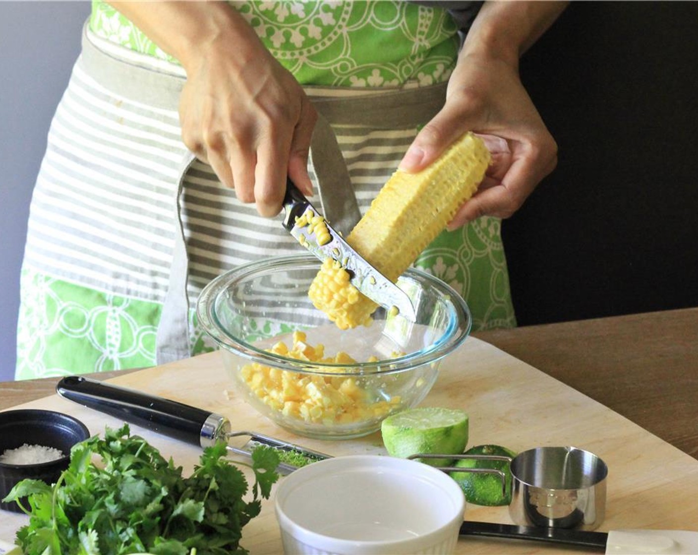 step 3 Chop and remove the seeds from the Jalapeño Pepper (1). Chop the Scallion (1 bunch) and Fresh Cilantro (1 bunch). Shuck the Corn (2 ears) and use a sharp knife to cut off the corn kernels from all sides. Put corn in a mixing bowl.