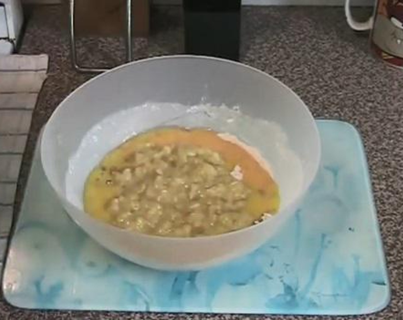 step 2 Add in the melted Butter (4.5 oz), beaten Eggs (2), and diced Bananas (3). Combine everything well.