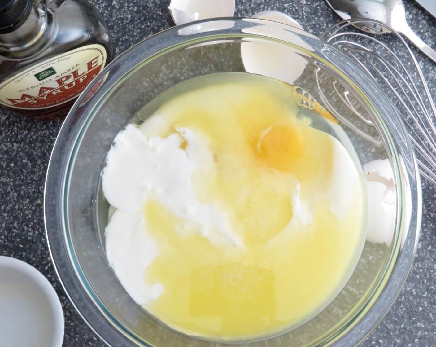 step 5 Shake the Buttermilk (2 cups) well. In a small bowl, add buttermilk, Eggs (2) and Maple Syrup (4 Tbsp). Whisk thoroughly to combine wet ingredients.
