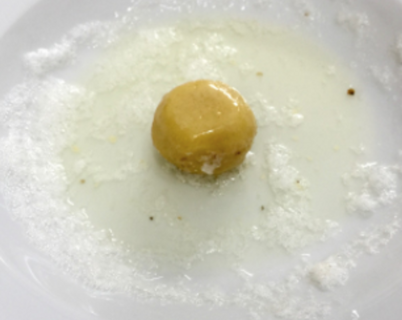 step 20 Then roll the dough ball in the whisked egg white. The egg white acts like a glue.