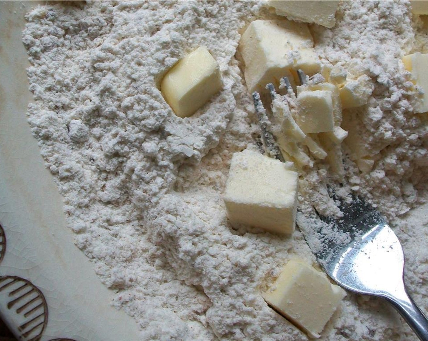 step 2 Mix together All-Purpose Flour (1 cup), Baking Powder (2 tsp), Pecan Halves (2 Tbsp), Salt (1 tsp), Ground Cinnamon (1/4 tsp), Ground Allspice (1/8 tsp), and Ground Nutmeg (1/4 tsp). Cut in Unsalted Butter (4 Tbsp) until it is the size of peas.