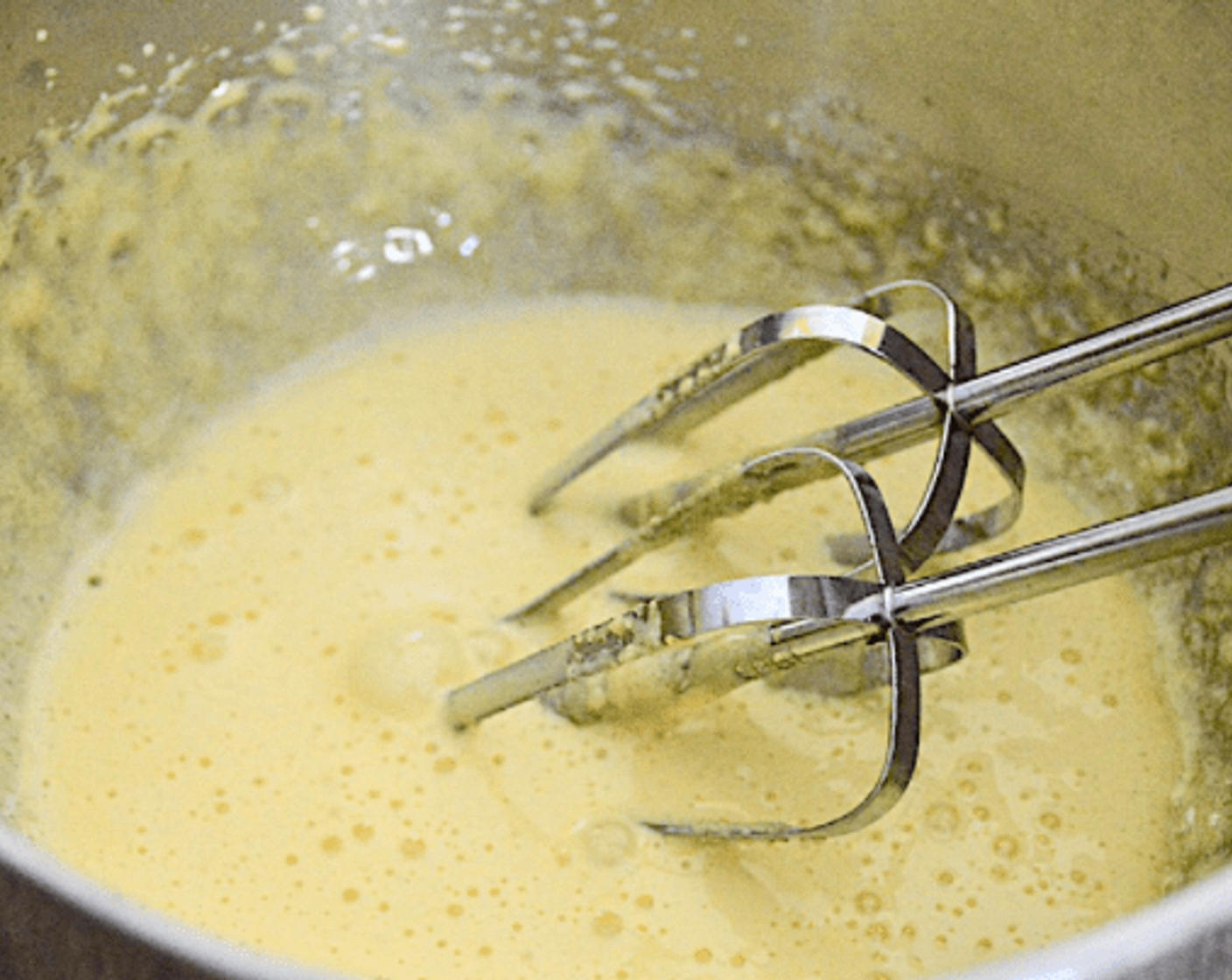 step 1 Whip up the Eggs (4) Yolks in a bowl with a hand mixer until they become pale yellow and thick for about 3 minutes. Slowly add in the Granulated Sugar (4 Tbsp) while you continue to mix. Set the egg mixture aside.