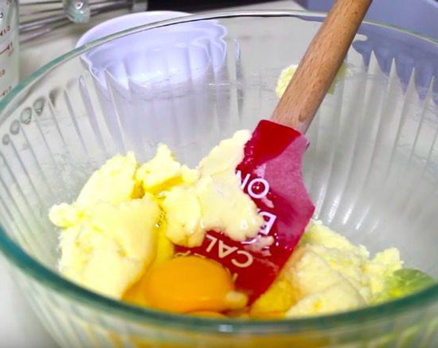 step 1 Grease a 13 by 9 pan and and pour Caramel Sauce (1/2 cup) on the pan and distribute the sauce evenly on the pan. Set aside. Take a large mixing bowl and add Butter (1/2 cup), Granulated Sugar (1 cup) and mix it together. Then, add Eggs (3), Vanilla Extract (2 tsp) and whisk it together.