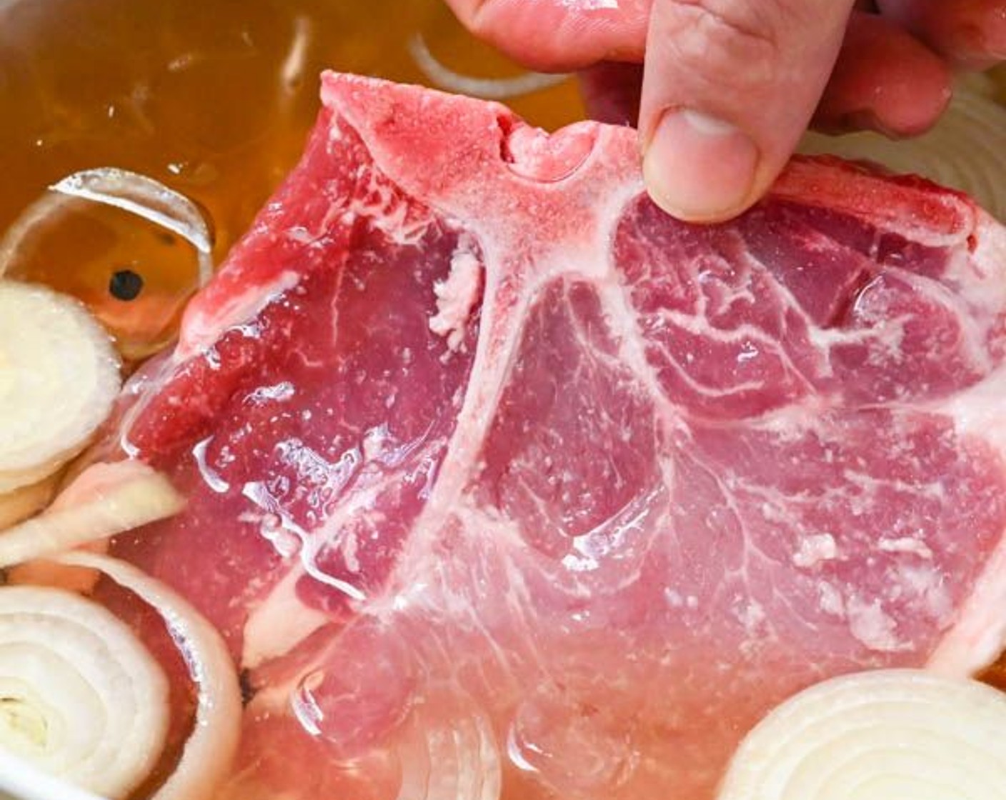 step 4 Add Pork Chops (2 lb), making sure they are covered by the brine solution.