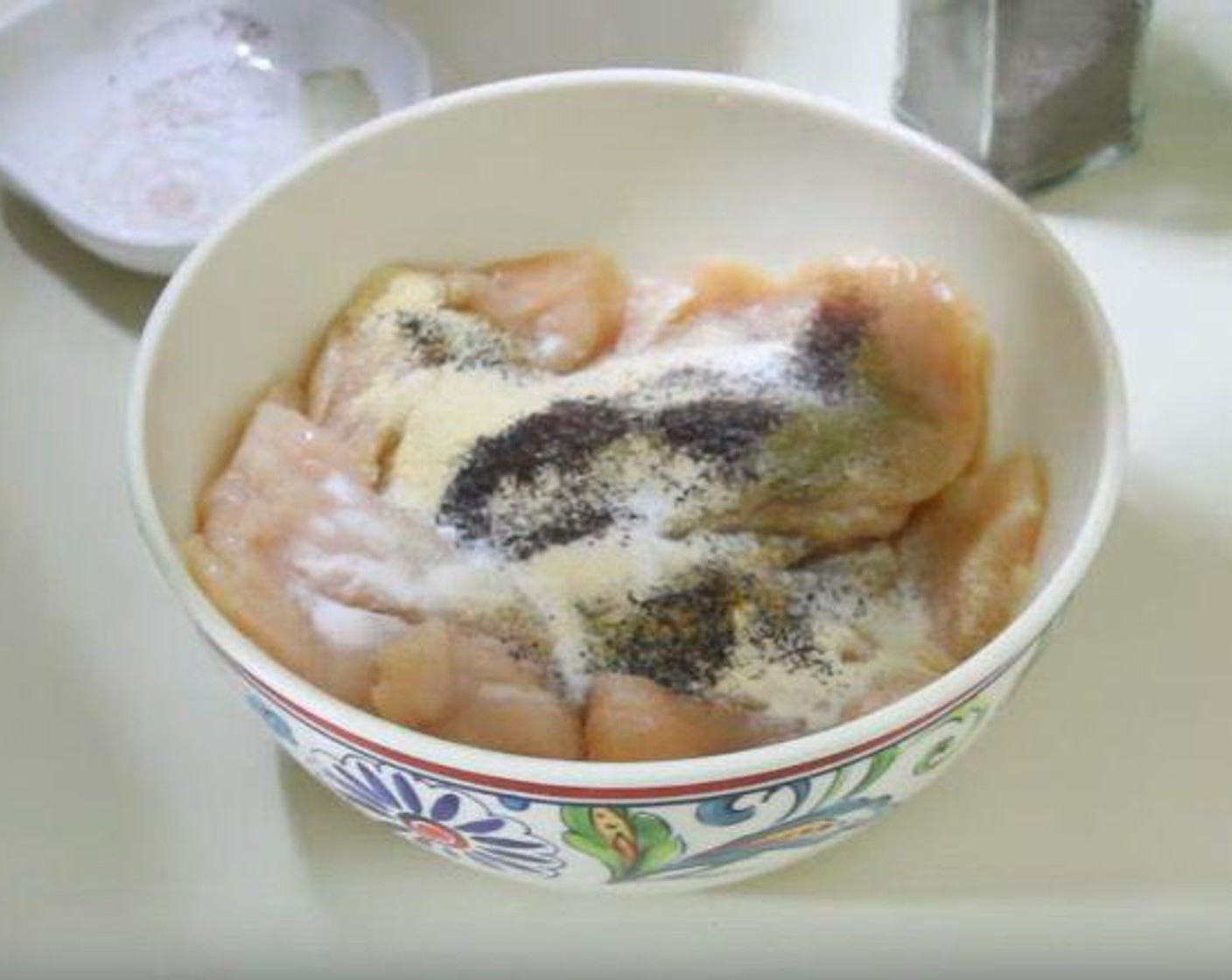 step 2 Season the Chicken Breasts (2) with Chili Powder (1 tsp), Ground Cumin (1/2 tsp), Onion Powder (1 tsp), Garlic Powder (1 tsp), Fresh Oregano (1/4 tsp), Salt (to taste), and Ground Black Pepper (to taste).